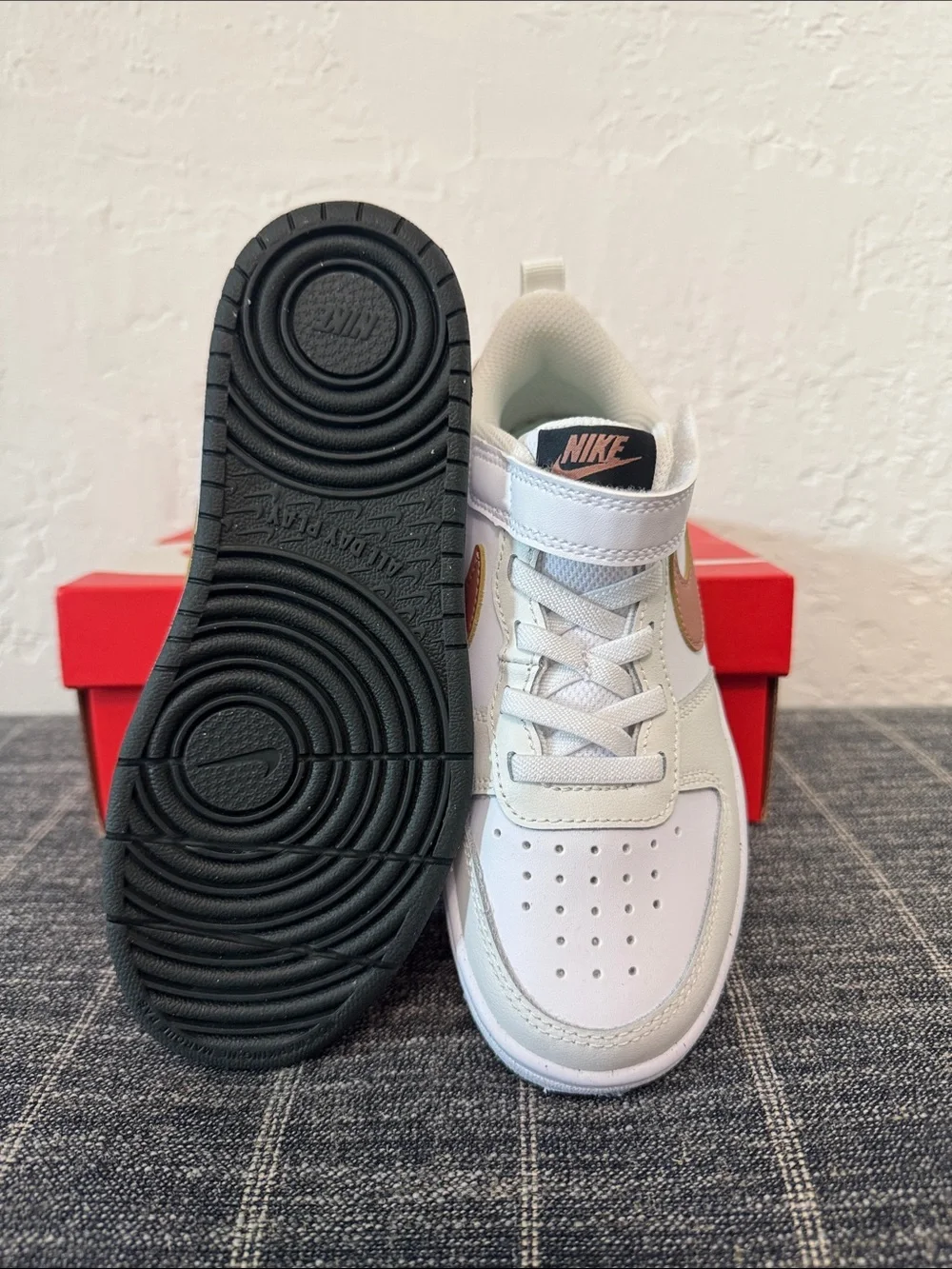 Nike Kids White Sneakers with Gold Swoosh